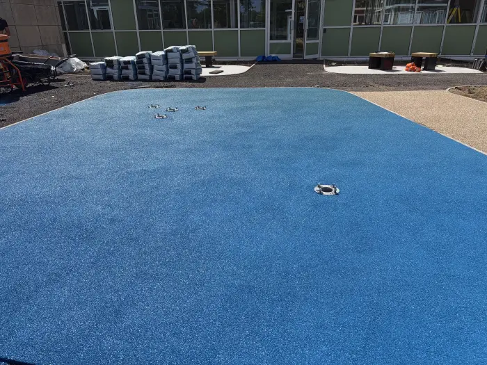 Rubber EPDM safety surfacing laid across a school play area, by A&P Resin