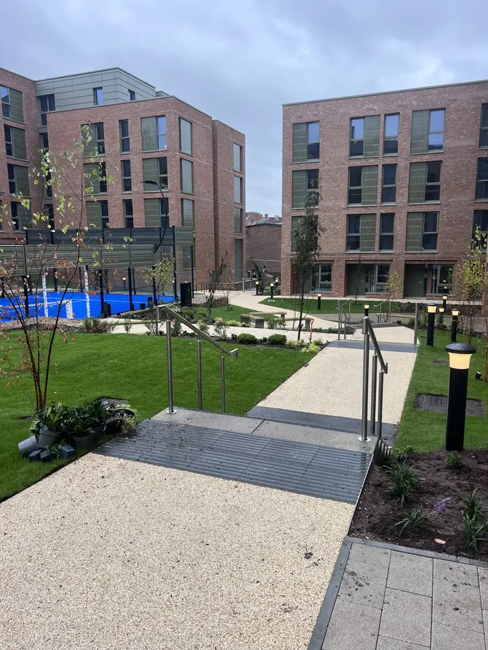 Resin bound pathways through a landscaped apartment courtyard, by A&P Resin