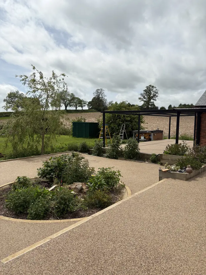 Resin bound path through a front garden with planting, by A&P Resin