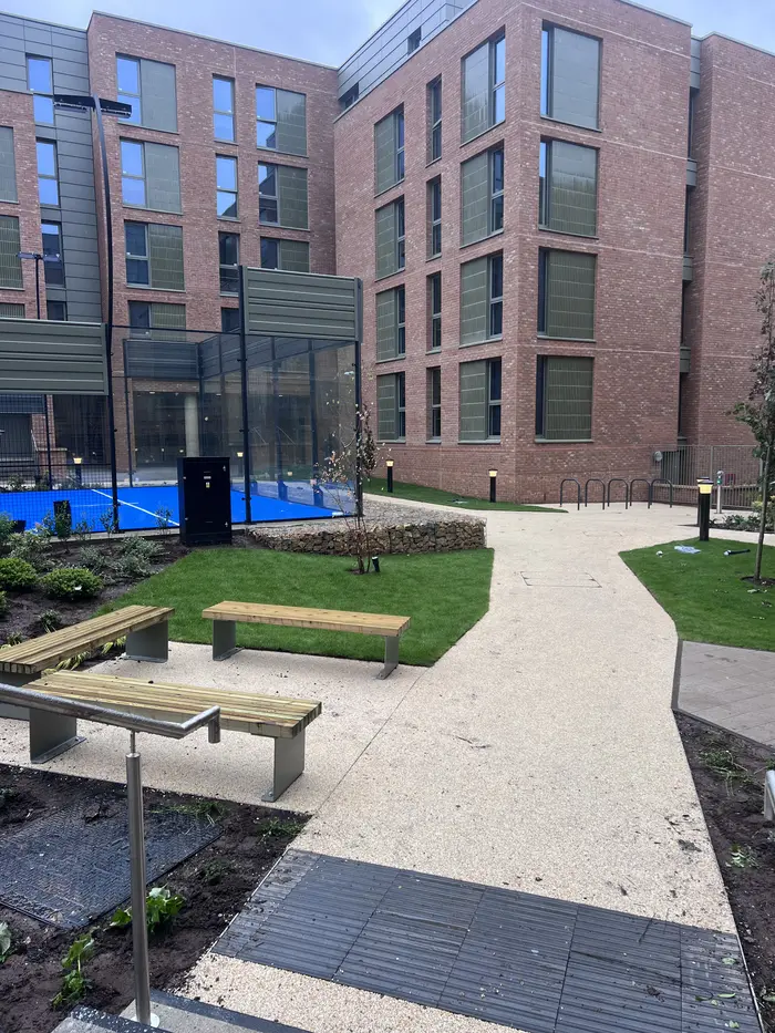 Resin bound courtyard paths with benches and lawns, by A&P Resin