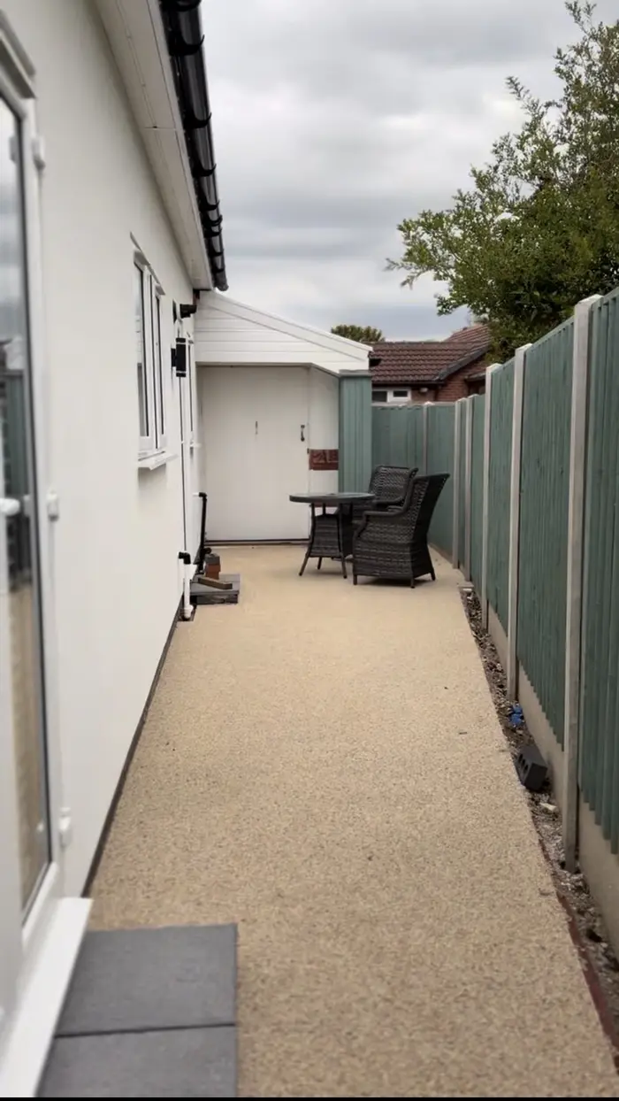 Cream resin bound side path beside a bungalow, by A&P Resin