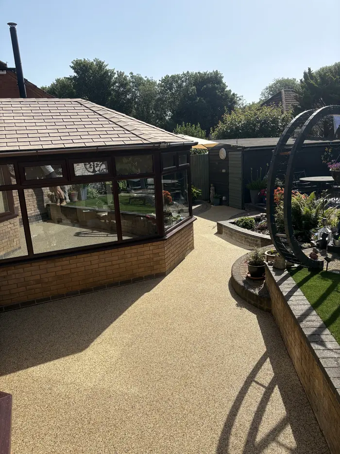 Resin bound patio beside a conservatory, by A&P Resin